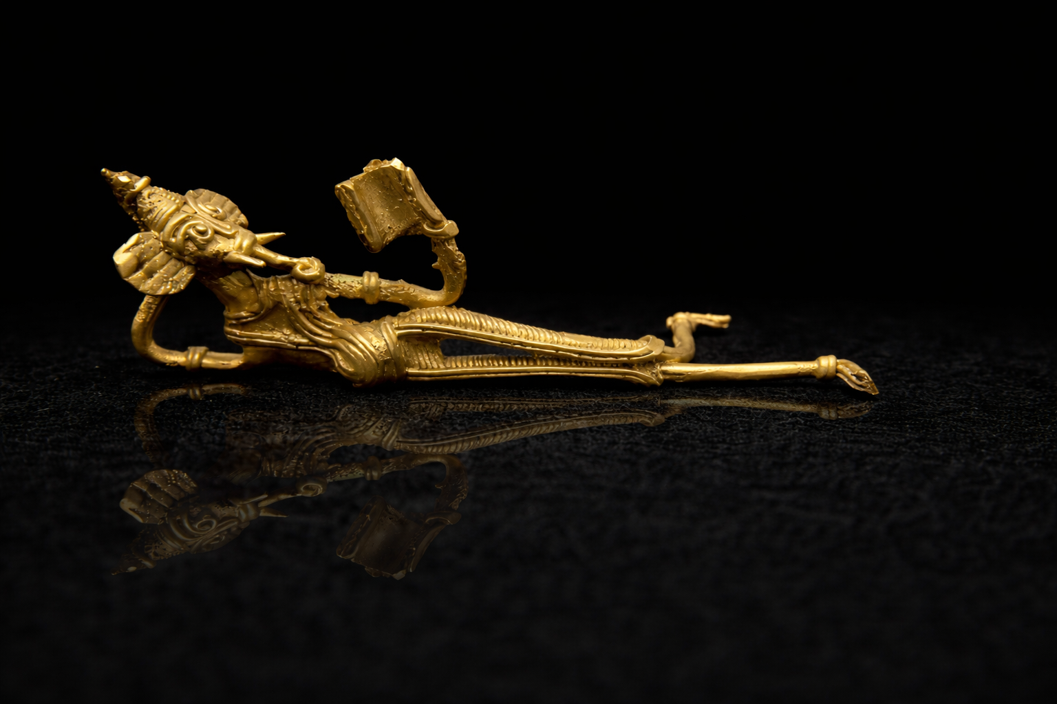 Shuye Boi Pora Ganesh – Reclining Reading Ganesha (Dhokra Brass Art)